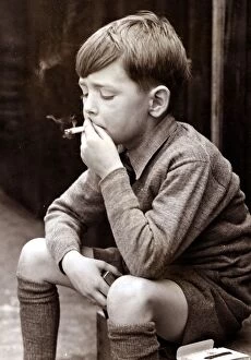 Postcard Cushion Collection: Naughty boy smoking a cigarette, circa 1950